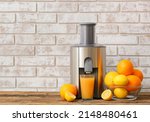 Small photo of New modern juicer and glass of fresh juice with fruits on wooden table