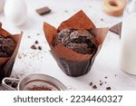 Sweet chocolate muffin on table