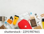 Small photo of Necessities for emergency bag on white background