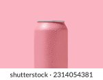 Can of fresh soda with water drops on pink background, closeup