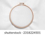 Wooden embroidery hoop with canvas as background