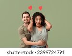 Funny young couple with paper hearts for Valentine's day on green background