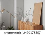 Wooden sideboard with vases and ...