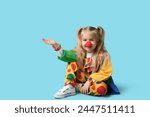 Smiling little girl in clown...