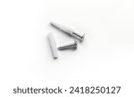 Small photo of Anchor with screw, White anchor with screw on white background, plastic anchor with stainless screw on white background, construction tool.