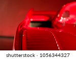 Focusing on the interior of a Ferrari red supercar on a red background