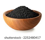 Small photo of black cumin seeds in brown wooden bowl isolated on white background