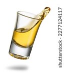 falling tequila shot with splash isolated on white background