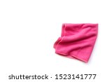 Closeup pink duster microfiber cloth for cleaning isolated on white background . Top view. Flat lay.