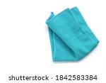 Closeup blue duster microfibre cloth for cleaning isolated on white background . Top view. Flat lay. Clipping path. Copy space.