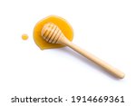 Honey with honey dipper isolated on white background. Top view. Flat lay.