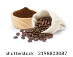 Roasted coffee beans in sack bag with coffe powder (ground coffee) in wooden bowl isolated on white background. 