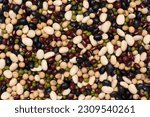 Small photo of Mix organic beans with soybean, red beans, green mung bean and black gram bean texture background. Top view, flat lay.