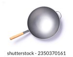 Empty iron frying pan with wooden handle isolated on white background with clipping path, top view, flat lay.