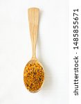 Small photo of Bee pollen granules in a wooden spoon on white background. Superfood, mixture of flower nectar, enzymes, honey, wax secretions. Nutrients, amino acids, lipids and vitamins.Flatlay,top view,copy space.