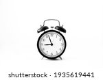 Black alarm clock isolated on white background. 9 o'clock. Morning, reminder. Time concept