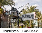 Small photo of LAKE BUENA VISTA, FL, USA - JANUARY 16, 2021: The exterior and sign of Jock Lindsey's Hangar Bar, which is an airplane hangar turned into a dive bar. Based off of Indiana Jones.