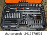 Small photo of Universal tool box, tool kit with set of hex, torx and screwdriver bits and ratchet wrench sockets