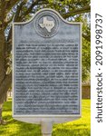 Small photo of Kingsville, Texas, USA - September 18, 2021: Plaque with the history of John Hawkins and the Englishmen in south Texas, at the courthouse