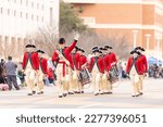 Small photo of Laredo, Texas, USA - February 19, 2022: The Anheuser-Busch Washington’s Birthday Parade, The Old Guard's Fife and Drum Corps is known for its red coats and tricorn hats