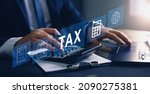 Small photo of Businessman using the laptop to fill in the income tax online return form for payment. Financial research,government taxes and calculation tax return concept. Tax and Vat concept.