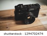 Small photo of Dubai, uae - jan 25 2019: vintage antique camera on wooden table , yashica electro 35 gtn