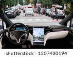Self driving electric car without driver on a city street. Autonomous mode. Head-up display.