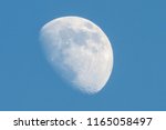 Increscent moon on blue sky background.