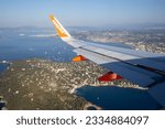 Small photo of Nantes, France - 12 July 2023 - wing of an Easyjet airplane flight in France.