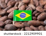 Small flag of Brazil in cocoa beans. Growing cocoa in Brazil, origin of cocoa used for making chocolate