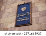 Small photo of A plate on the building of the Armenia Government. On the plate in Russian it says: the Republic of Armenia. Government