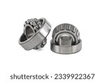 Small photo of Ball bearings and tapered roller bearing isolated on white background. Car bearings, auto parts, automobile components for the engine and chassis suspension