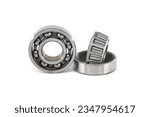 Small photo of Ball bearing and tapered roller bearing isolated on white background. Car bearings, auto parts, automobile components for the engine and chassis suspension