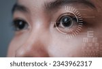 Small photo of Macro female eye and laser beam during visual acuity correction with eye chart. Laser eye surgery for glaucoma concept: eye with reticle or target overlay.