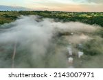 Aerial view drone shot of mountain tropical rainforest,Bird eye view image over the clouds Amazing nature background with clouds, and mountain peaks