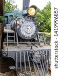 Small photo of McDonough, Georgia / USA - June 9, 2019: An H.K. Porter Steam Engine stands on static display at Heritage Village in Heritage Park in McDonough, GA.