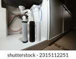 Small photo of House water filtration system to drinkable condition, reverse osmosis.Installation or replacement filter cartridges of foamed polypropylene, granular, briquettes carbon under kitchen sink with lights.
