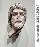 Small photo of Seattle - May 16, 2019: A close-up of a marble sculpture of a barbarian head, probably a Dacian, from the Roman Trajanic Period (1st - 2nd century CE) on display at the Seattle Art Museum.