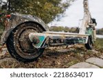 Not working electric scooter. Sunken scooter in shells and rust