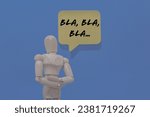 Small photo of Wooden mannequin dummy isolated on blue background and with message bubble above him with words BLAH BLAH BLAH illustrating chatty extroverted persons and with copy space for text.