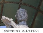 Small photo of Traunkirchen, Upper Austria, Austria - 05 29 2023: Head of the statue of Saint Nepomuk on the lake shore, shown here without the aureole that is otherwise often used