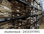 Small photo of Serock, Poland - May 13, 2023: yellowed folders with documents arranged on shelves in the historical archive in Serock, reflecting the atmosphere of past times and forgotten stories