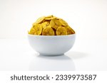 Small photo of Kerala chips or Banana chips, cult snack item of Kerala,arranged in a white bowl Isolated image with white background