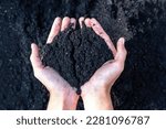 Small photo of Hands holding abundance soil for agriculture or preparing to plant Testing soil samples on hands with soil ground background. Dirt quality and farming concept. Selective focus on black soil in front