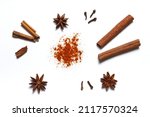Small photo of Spices anise, clove, paprika, cinnamon on white background.