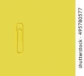 Yellow Paperclip On Yellow...