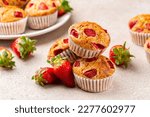 Close-up of strawberry banana muffins or cupcakes. Fruit homemade sweet bakery, pastry. Selective focus.