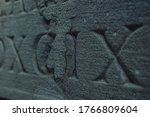 Old Roman Numerals Engraved On...
