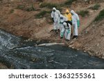Small photo of 05 APRIL 2019. Hazmat team wearing a Hazmat suit to clean a river after toxic chemical were dumped into the Sungai Kim Kim, sickening thousand of people who inhale noxious fumes in Johor
