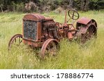 Abandoned Tractor In Grass Field